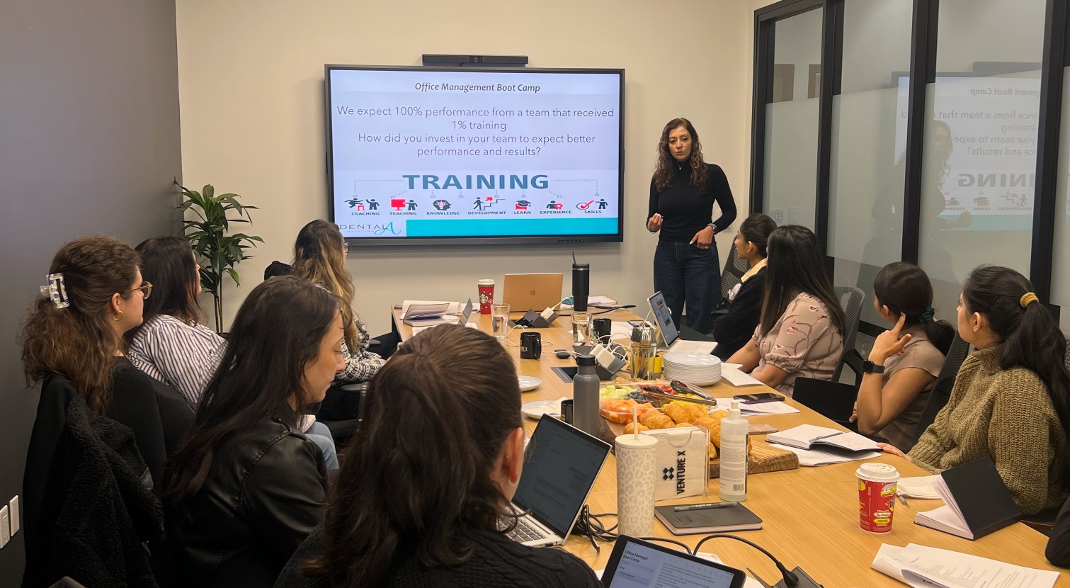 Tala Batarseh leading a dental office management boot camp training session